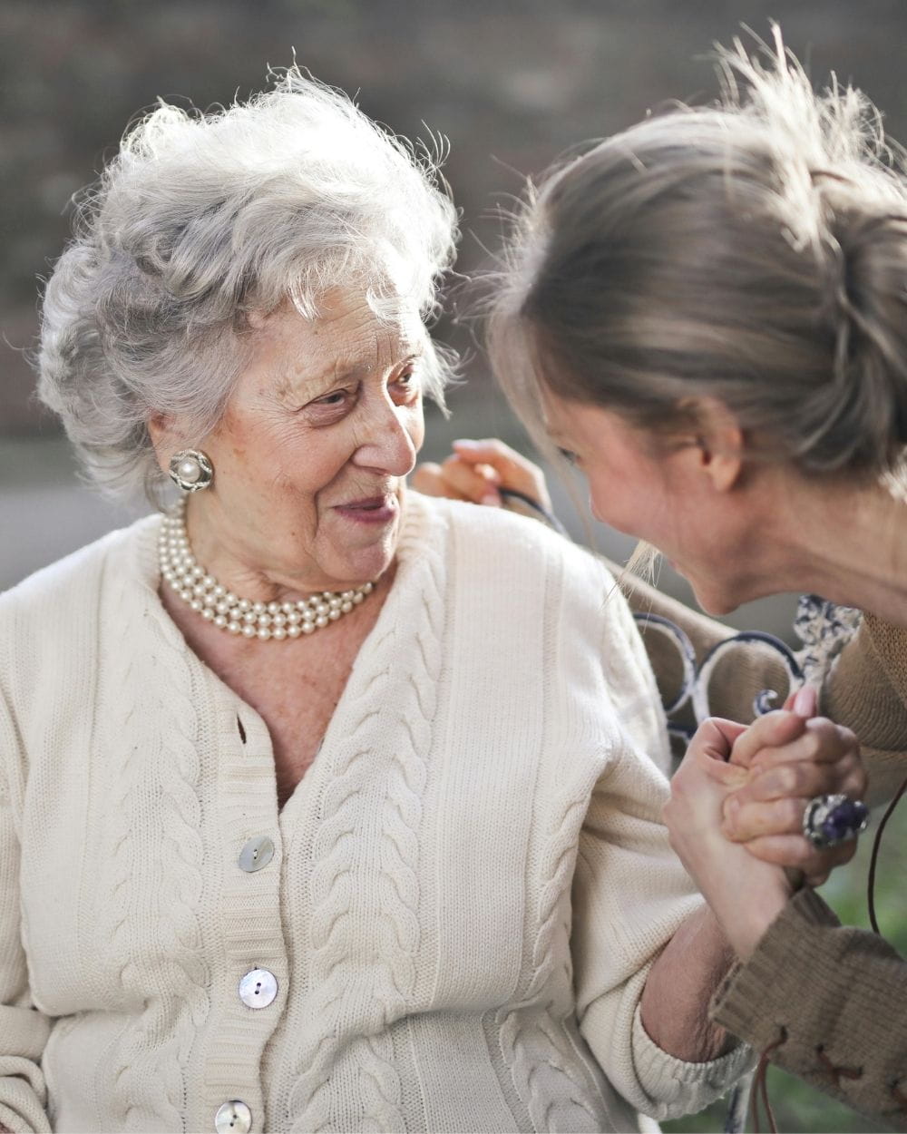 senior being cared for by daughter