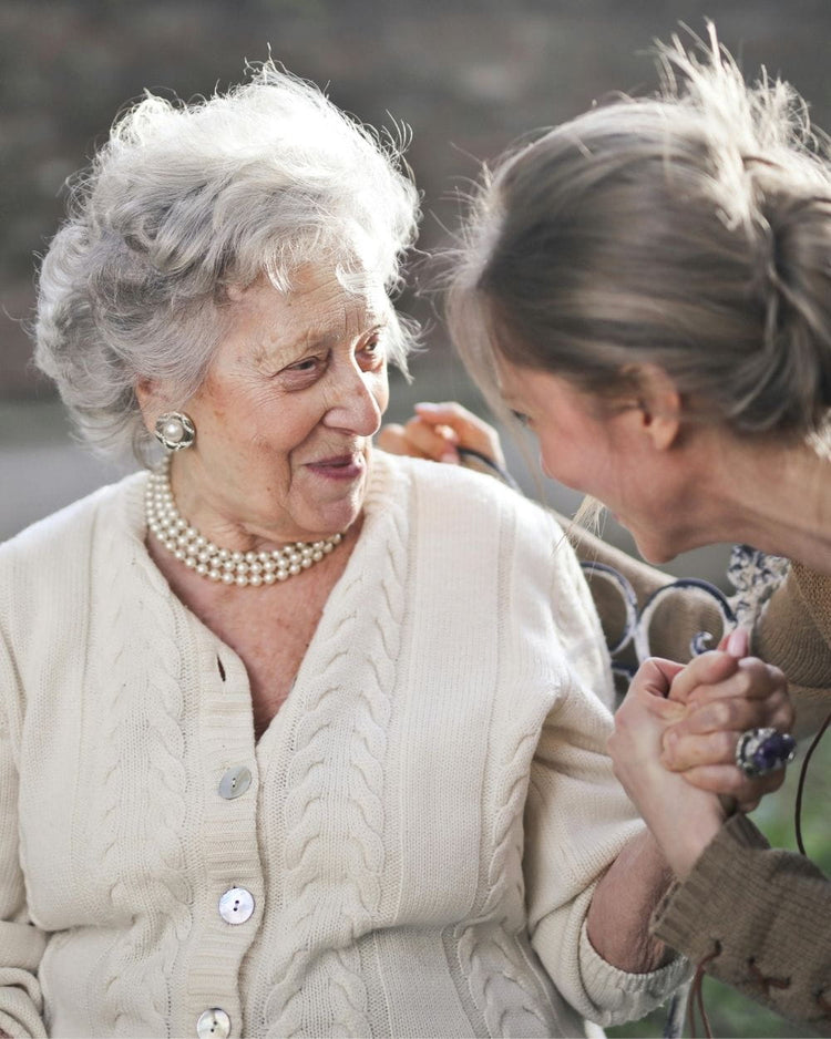senior being cared for by daughter