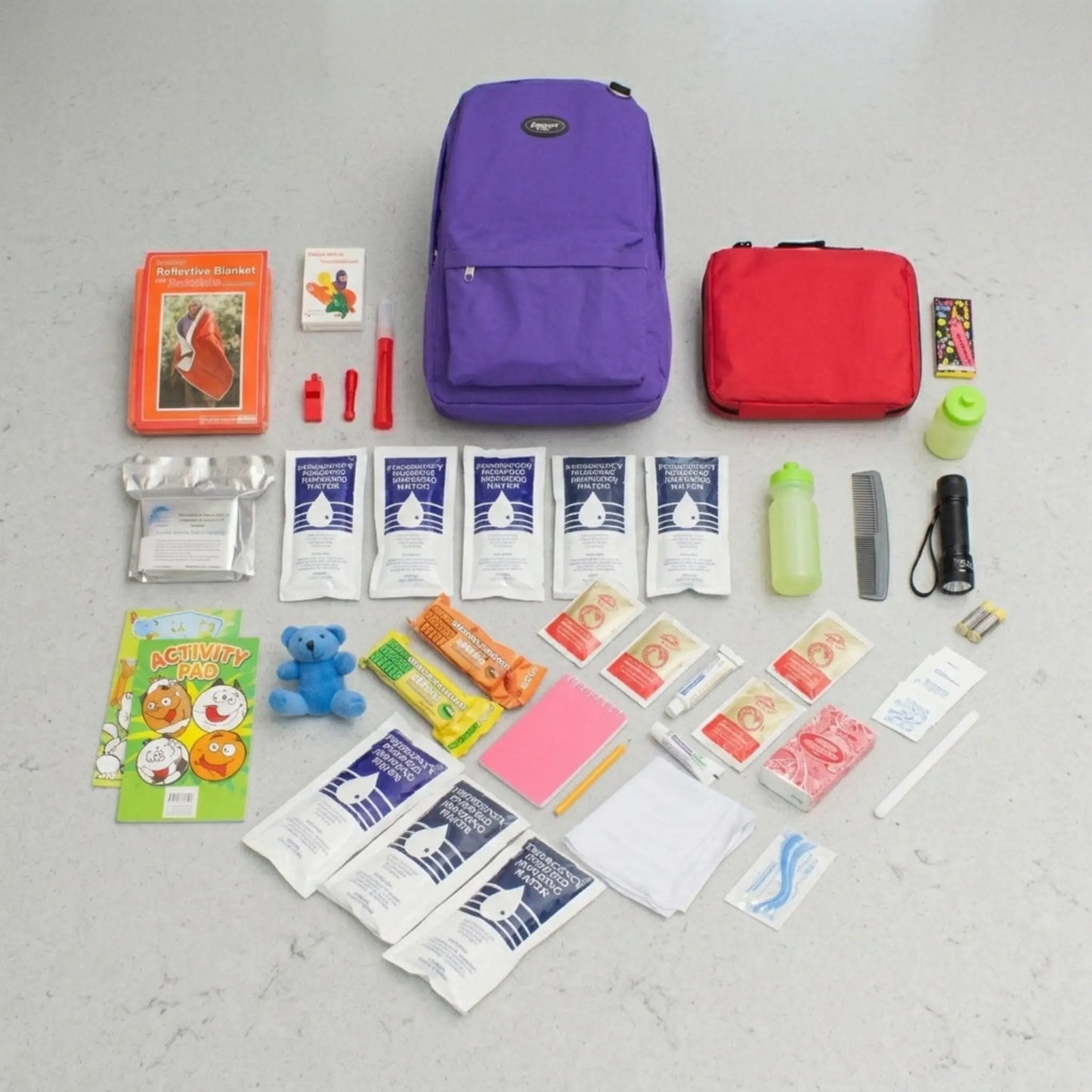 purple childrens emergency survival kit laid out with contents next to it for easy viewing