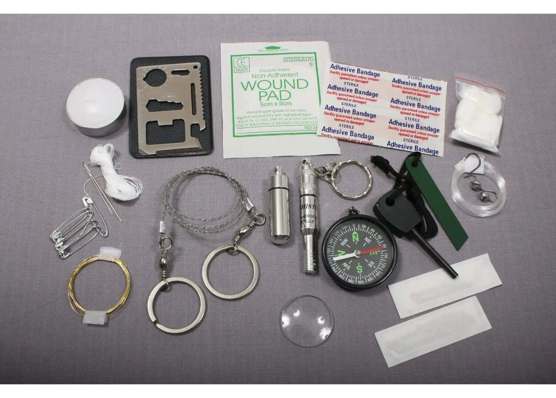 PocketShield survival kit items including blades fishing set and first aid supplies