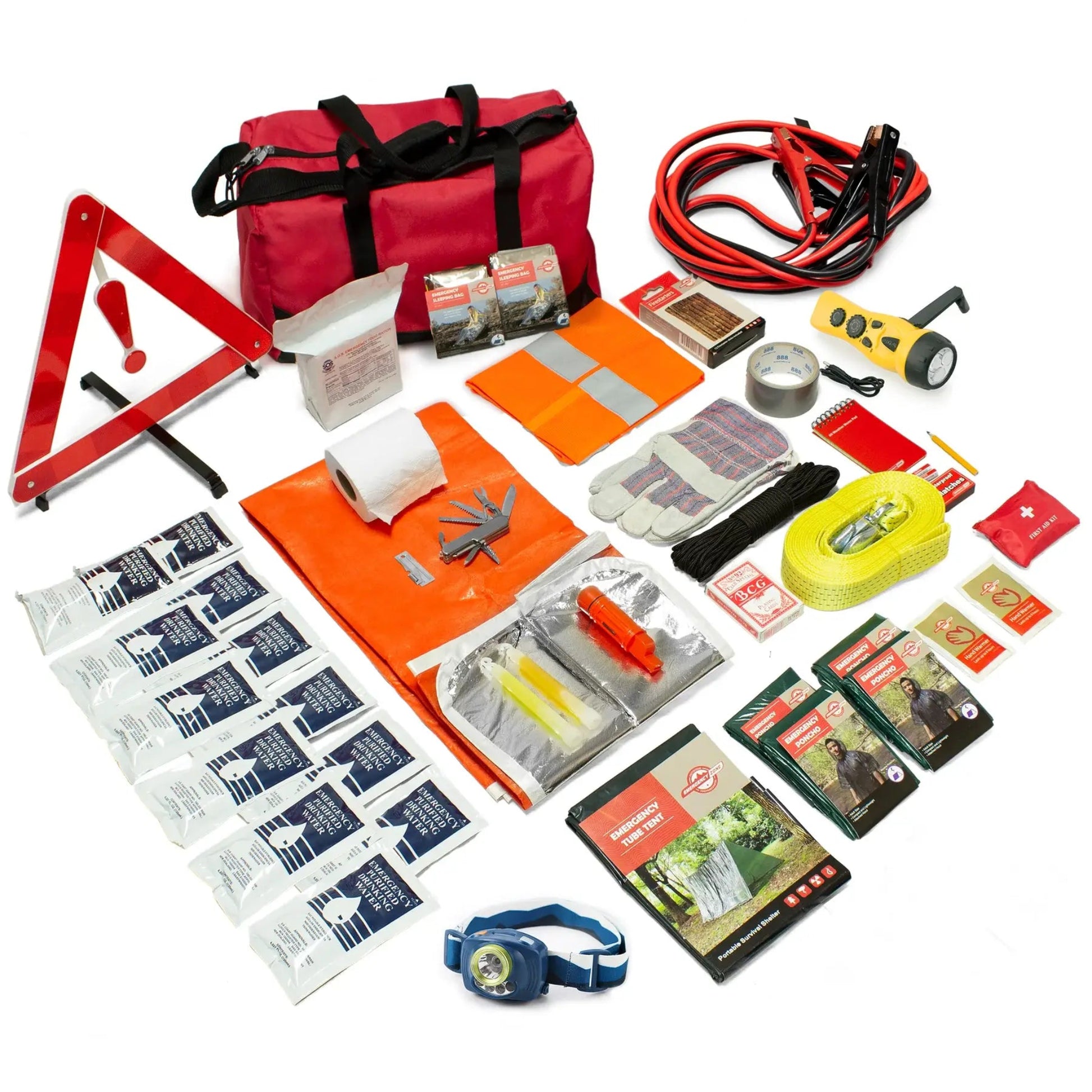 Collection of emergency road safety supplies including a red bag, warning triangle, flashlight, on a white background.