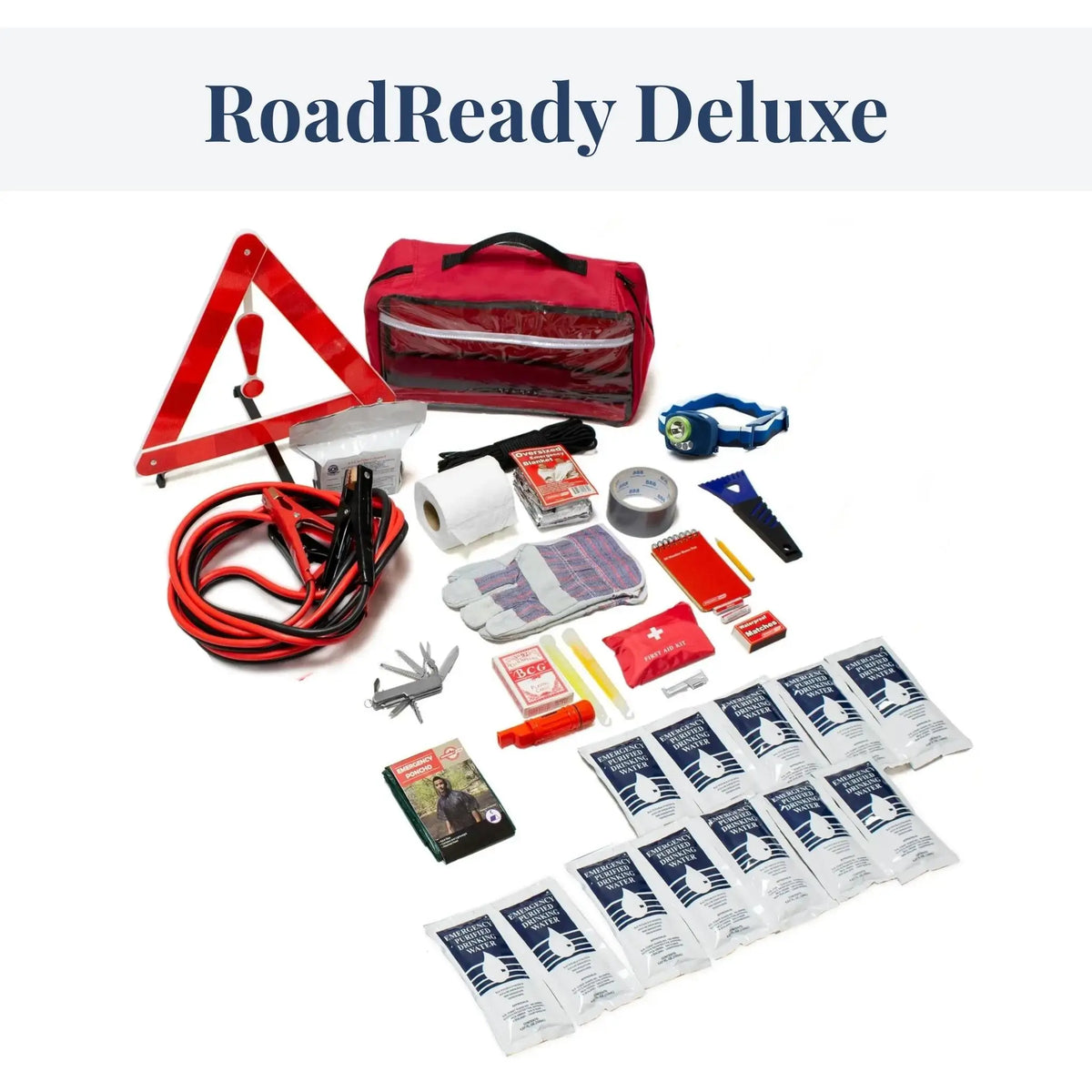 RoadReady Deluxe emergency preparedness kit laid out on a white background, including a red warning triangle, red bag, jumper leads, tape, gloves, multi-tool, first aid items, and multiple small pouches.
