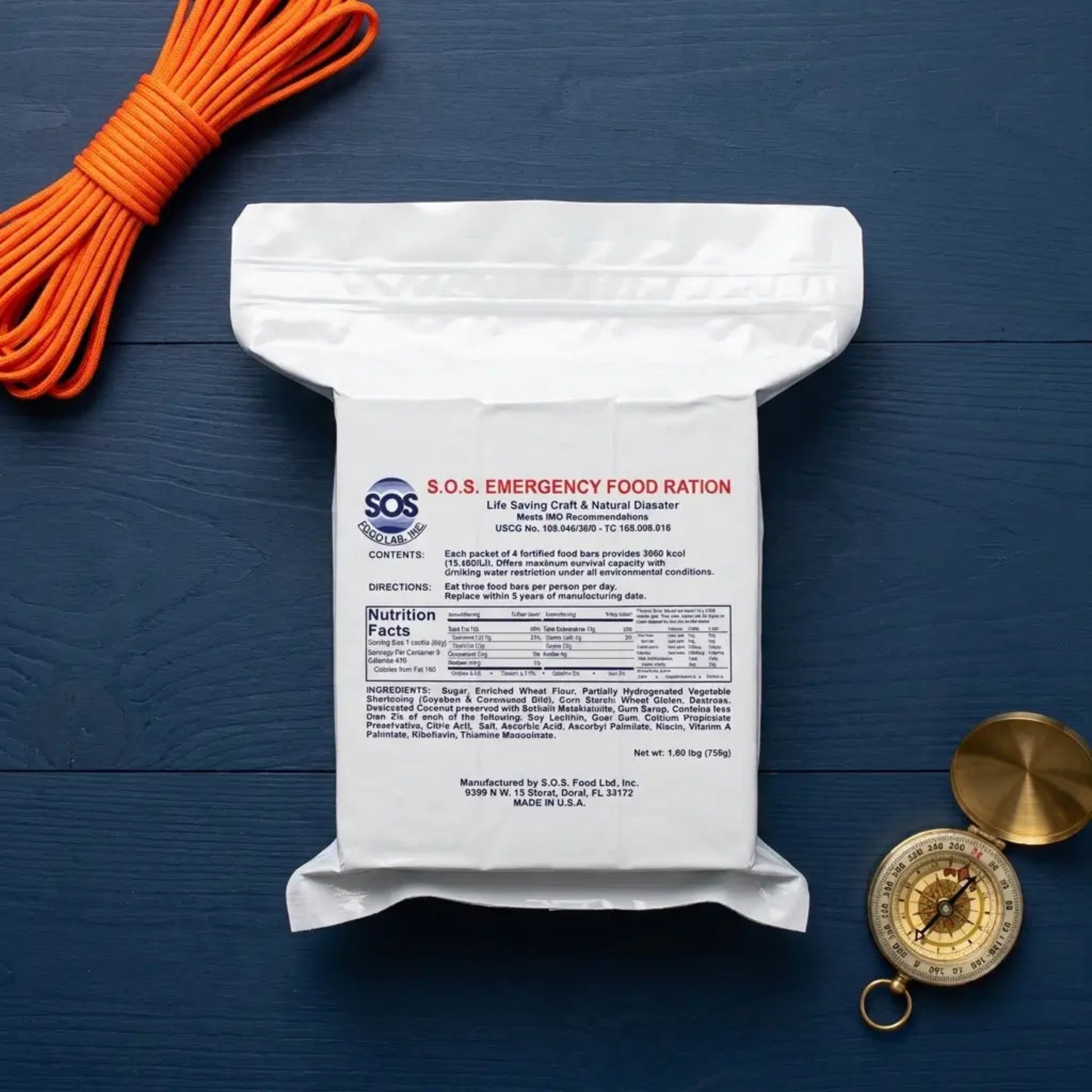 A white emergency food ration pouch labeled S.O.s. on blue background