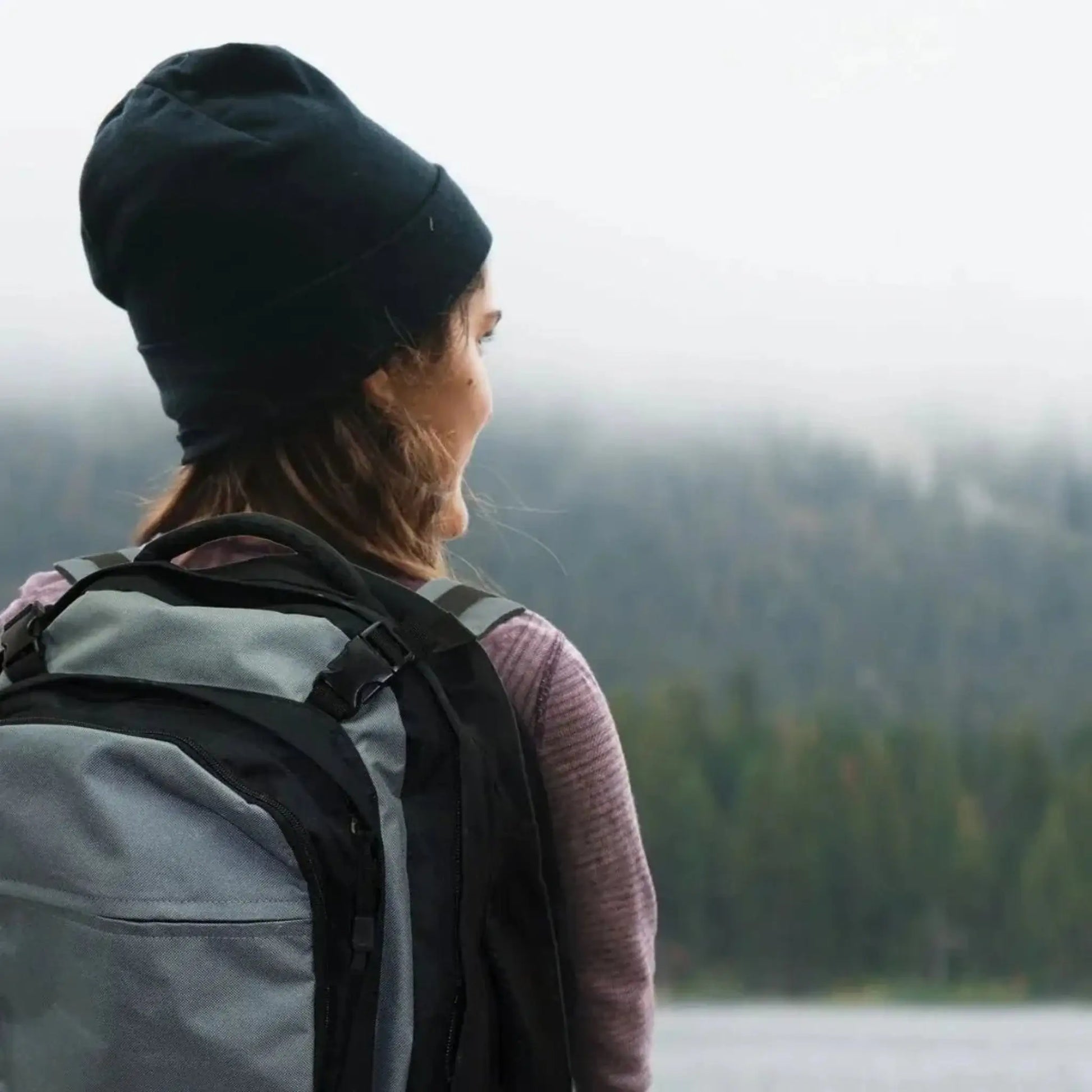 Person wearing the stealthshield emergency survival bag in lifestyle image